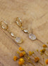 petites boucles d'oreilles dorées pendantes et quartz rutile goutte