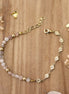 bracelet en laiton doré et pierre de lune pêche