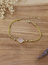 bracelet espiègle en laiton doré et quartz rose