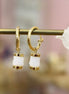 boucles d'oreilles dorées et cristal de roche