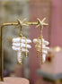 boucles d'oreilles haute fantaisie bijou de luxe fabriqué en france perles de nacre et étoile de mer doré