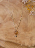 collier doré et pendentif cœur citrine